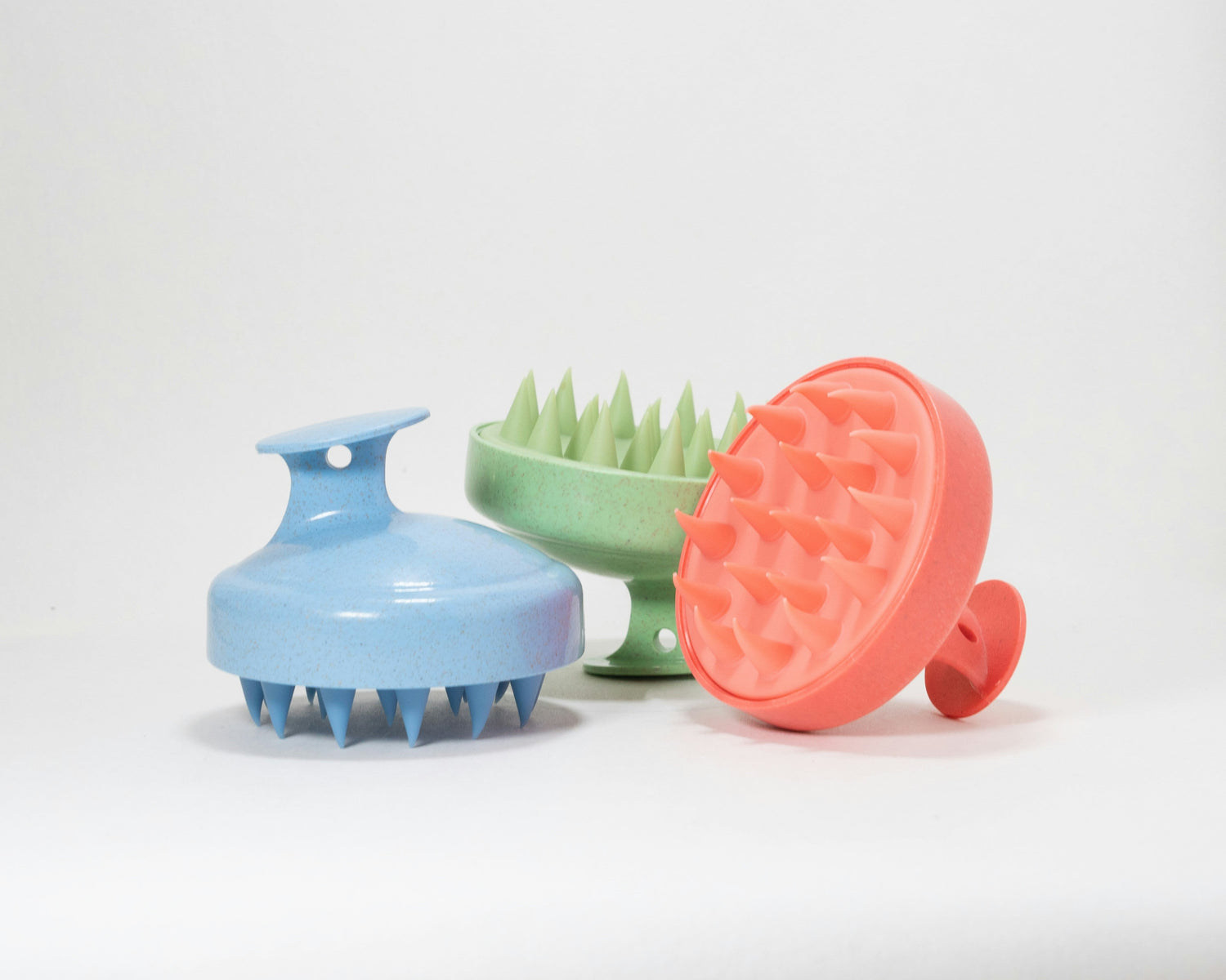 Silicone scalp massager brushes with flexible bristles for deep cleansing and scalp stimulation.